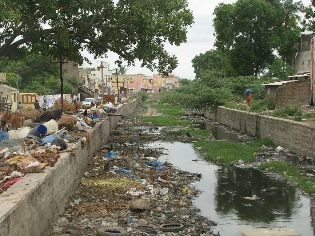 Indian roads, rivers, and paths littered with unprocessed garbage trash to show dangerous and toxic condition in India.